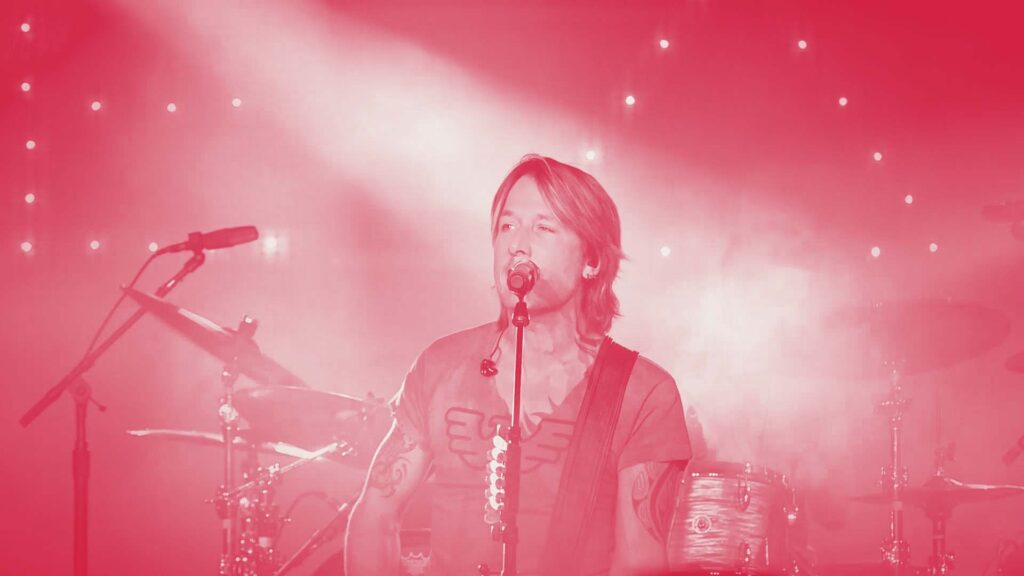 Picture of country singer Keith Urban performing on stage at the 2015 Wild West party.