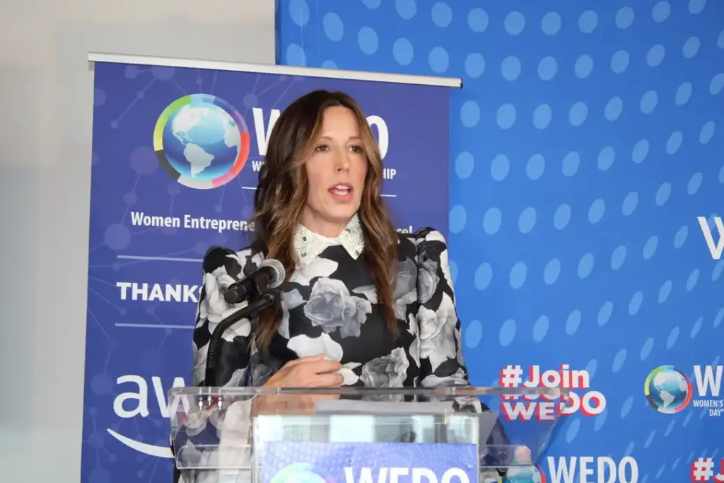 Jenny Just speaking at the Women Entrepreneurship Day Organization event.
